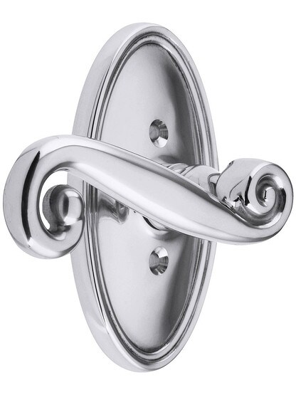 Oval Rosette Set With Scroll Design Levers Left Hand in Polished Chrome.